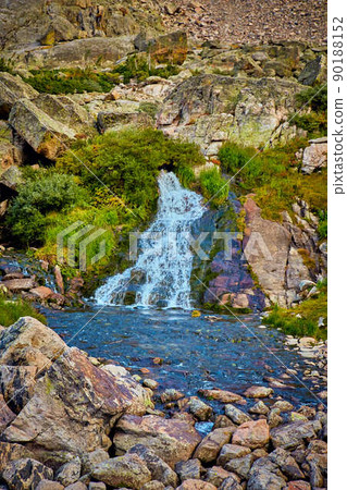 Waterfall with lichen boulders into river Waterfall with lichen boulders into river 90188152