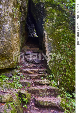 Stair stone steps up into rock tunnel Stair stone steps up into rock tunnel 90189064