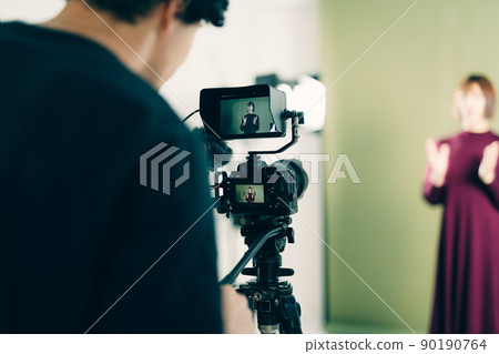 Photographer taking a photo 90190764