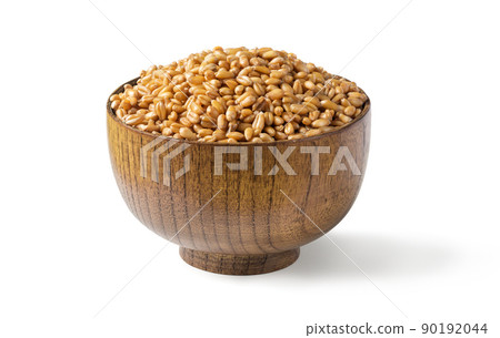 Wheat grain in wooden bowl isolated on a white background. Wheat grain in wooden bowl isolated on a white background. 90192044