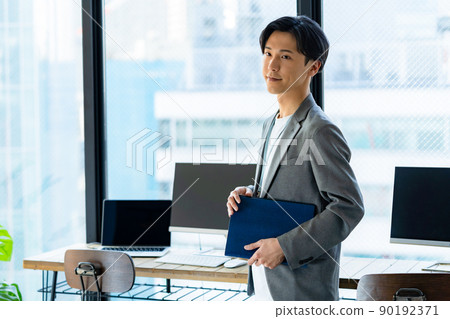 Young man working in the office Young man working in the office 90192371