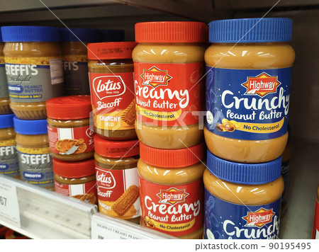 SELANGOR, MALAYSIA -MAY 24, 2022: Peanut butter in commercial bottles is on display for sale in stores. Labeled by brand and price tagged for customer convenience. SELANGOR, MALAYSIA -MAY 24, 2022: Peanut butter in commercial bottles is on display for sale in stores. Labeled by brand and price tagged for customer convenience. 90195495