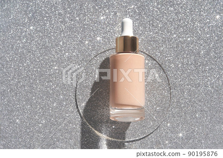 Beige foundation texture swatch. Cream drop with silver sparkles. Face skincare 90195876