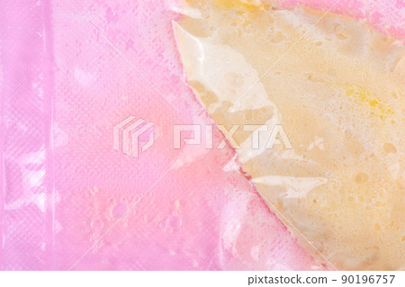 Sous vide chicken breast cooked in a vacuum sealed transparent bag on pink background 90196757