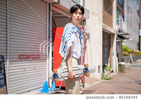 Skateboard and male penny cruiser Skateboard and male penny cruiser 90198345