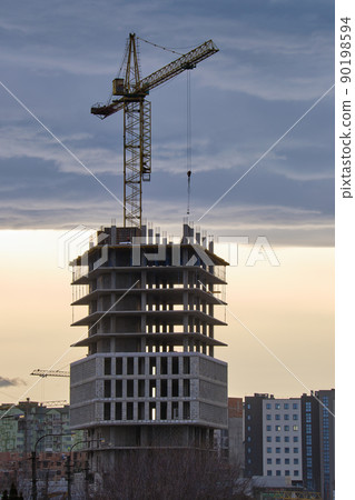 Tower cranes at high residential apartment buildings construction site. Real estate development Tower cranes at high residential apartment buildings construction site. Real estate development 90198594