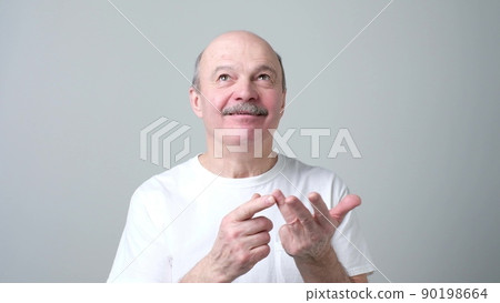 Businessman is giving a second warning isolated on white Businessman is giving a second warning isolated on white 90198664
