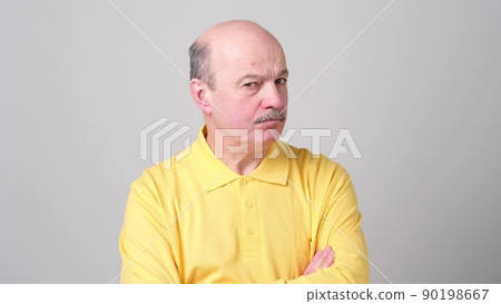 Not sure. Mature adult in shirt having a doubt 90198667