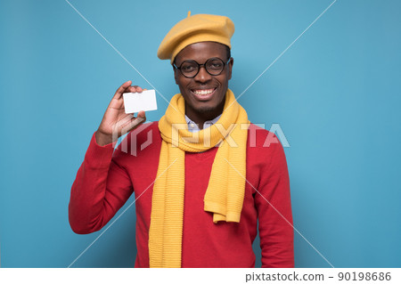 African young man bank manager showing credit card for online shopping African young man bank manager showing credit card for online shopping 90198686