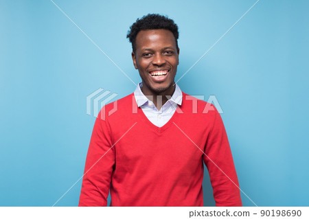 Smiling african man ooking at camera. Portrait of black confident man. 90198690