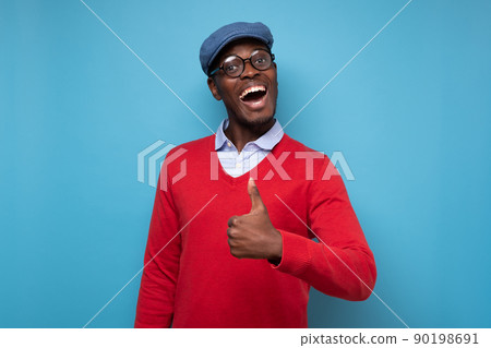 happy african american handsome man laughing and showing thumb up gesture 90198691