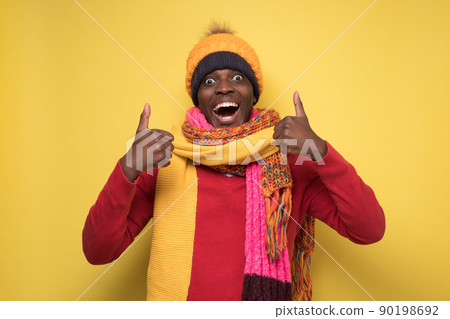 happy african american handsome man laughing and showing thumb up gesture 90198692