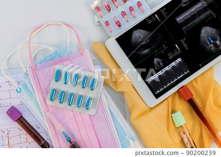 Doctor medical worktable with stethoscope on research in ultrasound 3d cardiac examination of the patient on digital table 90200239