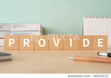 A desk with building blocks labeled "PROVIDE" 90201615