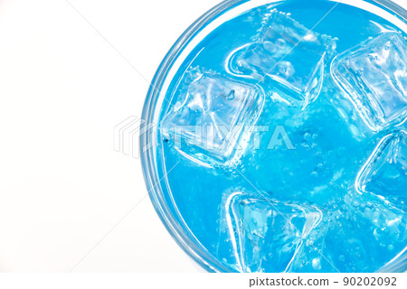 Blue Hawaii sparkling water with ice cubes close-up. 90202092