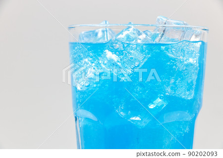 Blue Hawaii sparkling water with ice cubes close-up. Blue Hawaii sparkling water with ice cubes close-up. 90202093