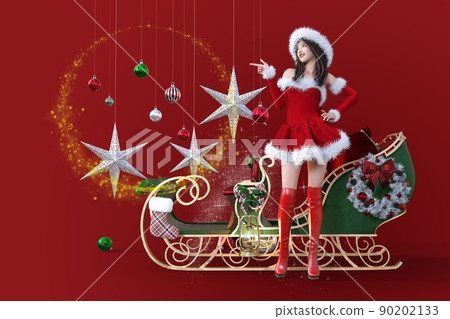 一個美麗的聖誕裝飾，在可愛的雪橇和一個穿著聖誕老人衣服的女人面前閃閃發光，上面有一個可愛的酒窩，指向旅行的方向 90202133