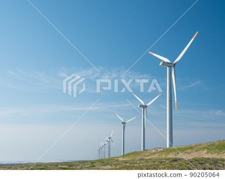 Windmills for wind power generation in the blue sky and coast. Hazaki Wind Farm on the Sudahama coast in Kamisu City, Ibaraki Prefecture. 90205064