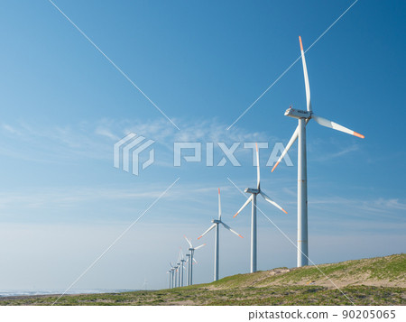 Windmills for wind power generation in the blue sky and coast. Hazaki Wind Farm on the Sudahama coast in Kamisu City, Ibaraki Prefecture. 90205065