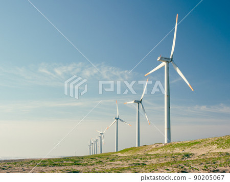Windmills for wind power generation in the blue sky and coast. Hazaki Wind Farm on the Sudahama coast in Kamisu City, Ibaraki Prefecture. 90205067