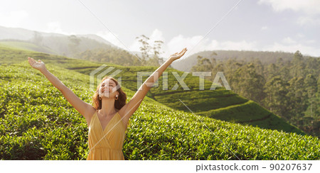 Woman traveler against natural background tea plantations landscape Woman traveler against natural background tea plantations landscape 90207637