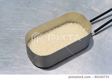 Rice cooked at the camp: Rice before cooking in Mestin 90208735