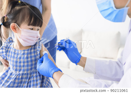 Medical Doctor injecting child with vaccine clinic Medical Doctor injecting child with vaccine clinic 90211061