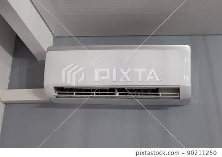 Air conditioner on gray wall room interior background 90211250