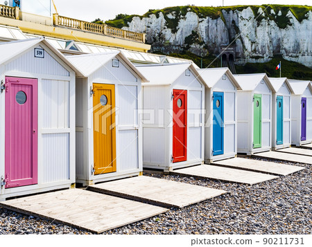 Colorful bathing huts in Le Treport beach, Normandy, France Colorful bathing huts in Le Treport beach, Normandy, France 90211731