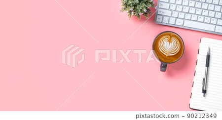 Pink office desk with keyboard computer, Pen, notebook and Cup of coffee, Top view with copy space, Mock up.. Pink office desk with keyboard computer, Pen, notebook and Cup of coffee, Top view with copy space, Mock up.. 90212349