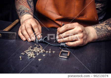 Leather Professional creates a new leatherwork at his studio Leather Professional creates a new leatherwork at his studio 90213074
