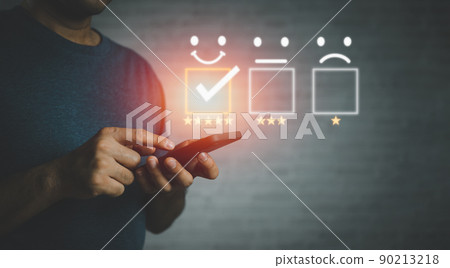 Man hand using smartphone with popup five star icon for feedback review satisfaction service, Customer service experience and business satisfaction survey. Man hand using smartphone with popup five star icon for feedback review satisfaction service, Customer service experience and business satisfaction survey. 90213218