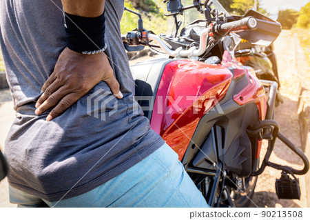 Asian man suffering from backache,acute lower back pain from sitting in wrong position,male have painful and aches after a long ride on motorcycle,problems of spine diseases and muscle inflammation Asian man suffering from backache,acute lower back pain from sitting in wrong position,male have painful and aches after a long ride on motorcycle,problems of spine diseases and muscle inflammation 90213508