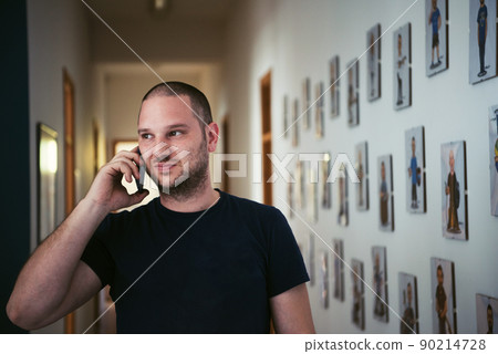 a portrait of a man in a work suit standing in the hallway of a factory a portrait of a man in a work suit standing in the hallway of a factory 90214728