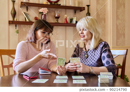 Session of mental therapy, mature female psychologist using metaphorical associative cards Session of mental therapy, mature female psychologist using metaphorical associative cards 90214790