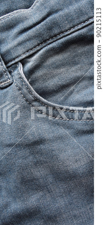 Close up detail of pocket of light blue jeans 90215113