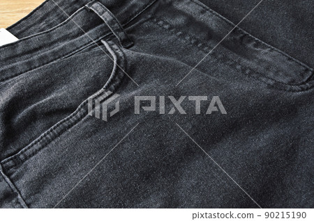 Zipper pocket and buttons close-up detail of light black jeans 90215190