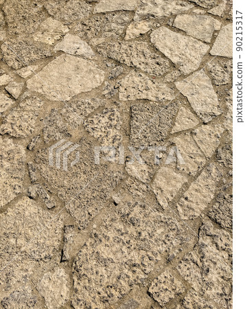 texture of a sandstone wall close-up texture of a sandstone wall close-up 90215317