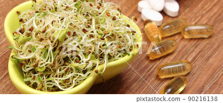 Radish sprouts and tablets supplements. Choice between healthy eating and pills 90216138