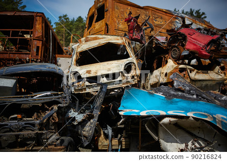 A lot of rusty burnt cars in Irpen, after being shot by the Russian military. Russia's war against Ukraine. Cemetery of destroyed cars of civilians who tried to evacuate from the war zone A lot of rusty burnt cars in Irpen, after being shot by the Russian military. Russia's war against Ukraine. Cemetery of destroyed cars of civilians who tried to evacuate from the war zone 90216824