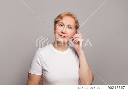 Mature beautiful woman with hand near head Mature beautiful woman with hand near head 90218867