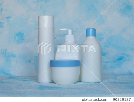 Bottles for cosmetic products without a label. Facial skin care concept. Texture background 90219127