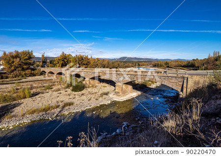 The entrance bridge of Puente la Reina de Jaca in Aragon, Spain 90220470