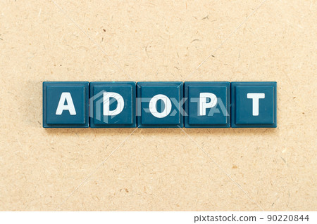 Tile alphabet letter in word adopt on wood background Tile alphabet letter in word adopt on wood background 90220844