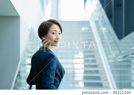 Business woman walking on the stairs Photo cooperation: LINK FOREST 90221306