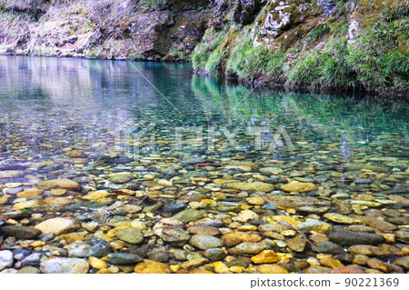 Mossy rocks and a beautiful stream of pure murmuring Mossy rocks and a beautiful stream of pure murmuring 90221369