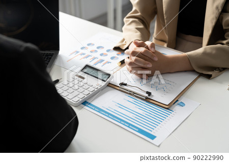 Business adviser meeting to analyze and discuss the situation on the financial report in the meeting room.Investment Consultant, Financial advisor and accounting concept 90222990