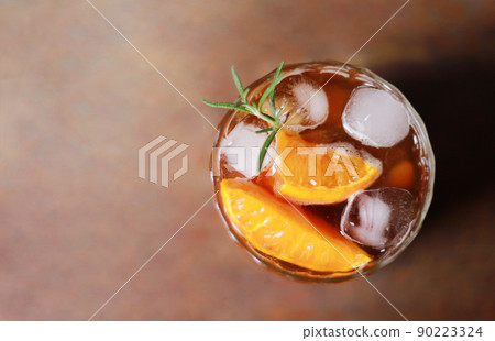 top view of iced Americano coffee mixed with orange for fresh drinking in free time 90223324
