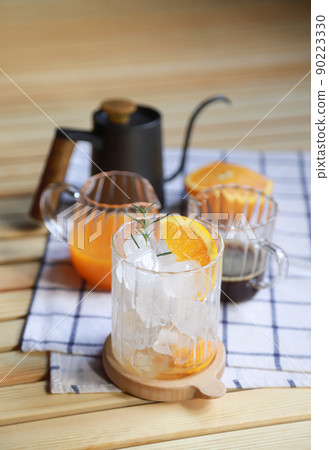 drinking preparing of making orange americano coffee in free time of people living life 90223330