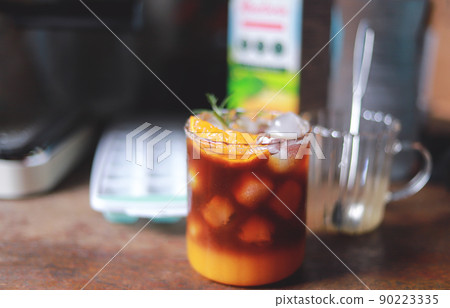 homemade orange Americano coffee from time making drink for healthy living life. selective focus 90223335